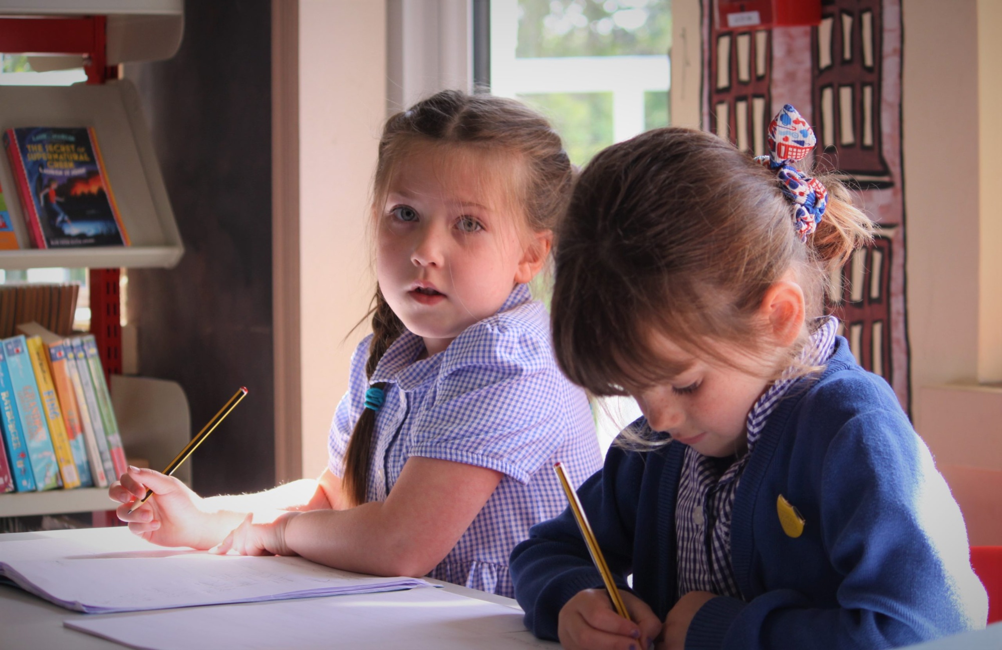 Y1_girls_writing_colour-scaled.jpg